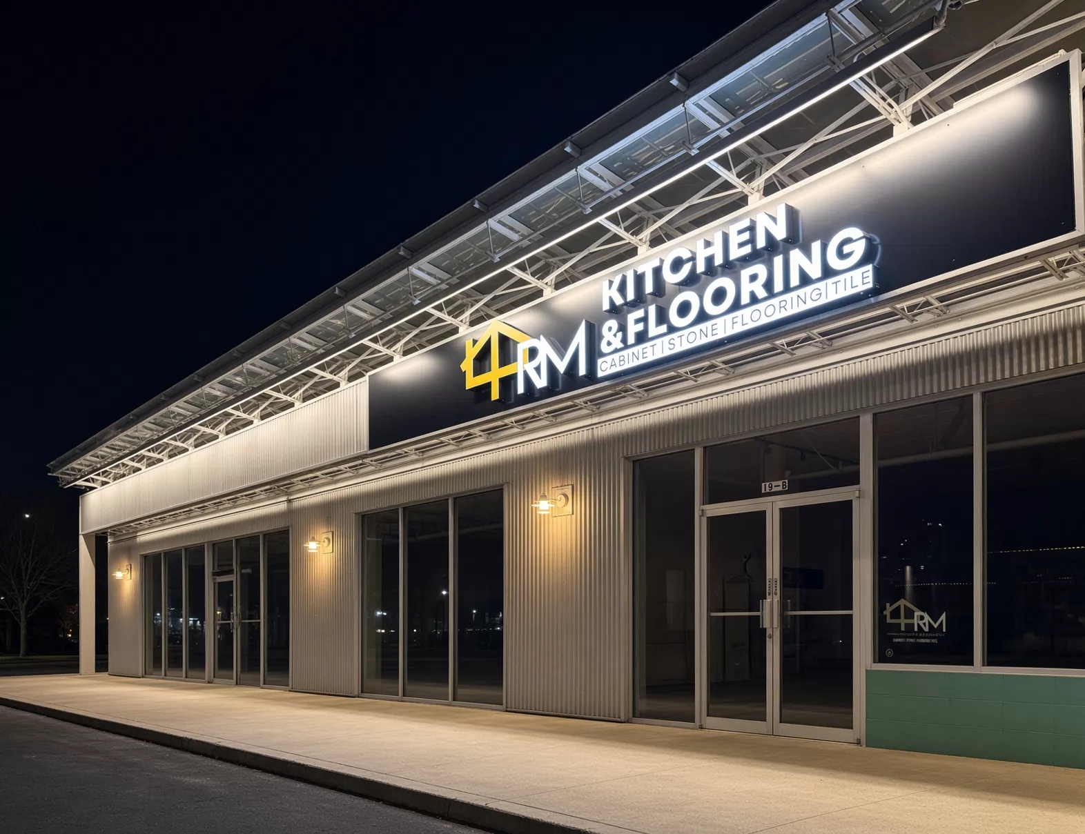 4RM Kitchen & Flooring illuminated channel letters on a storefront at night