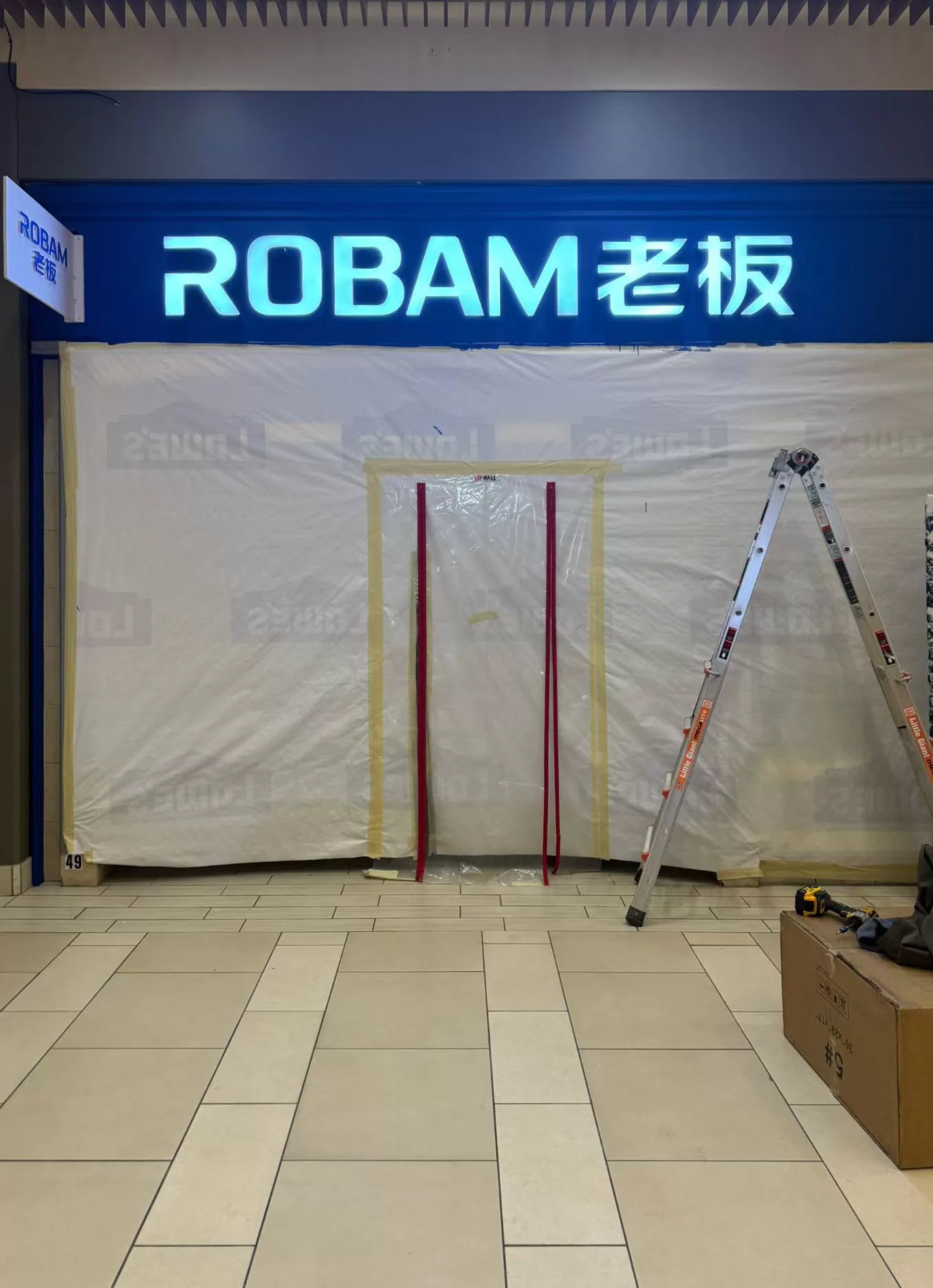 ROBAM illuminated storefront sign with installation equipment below