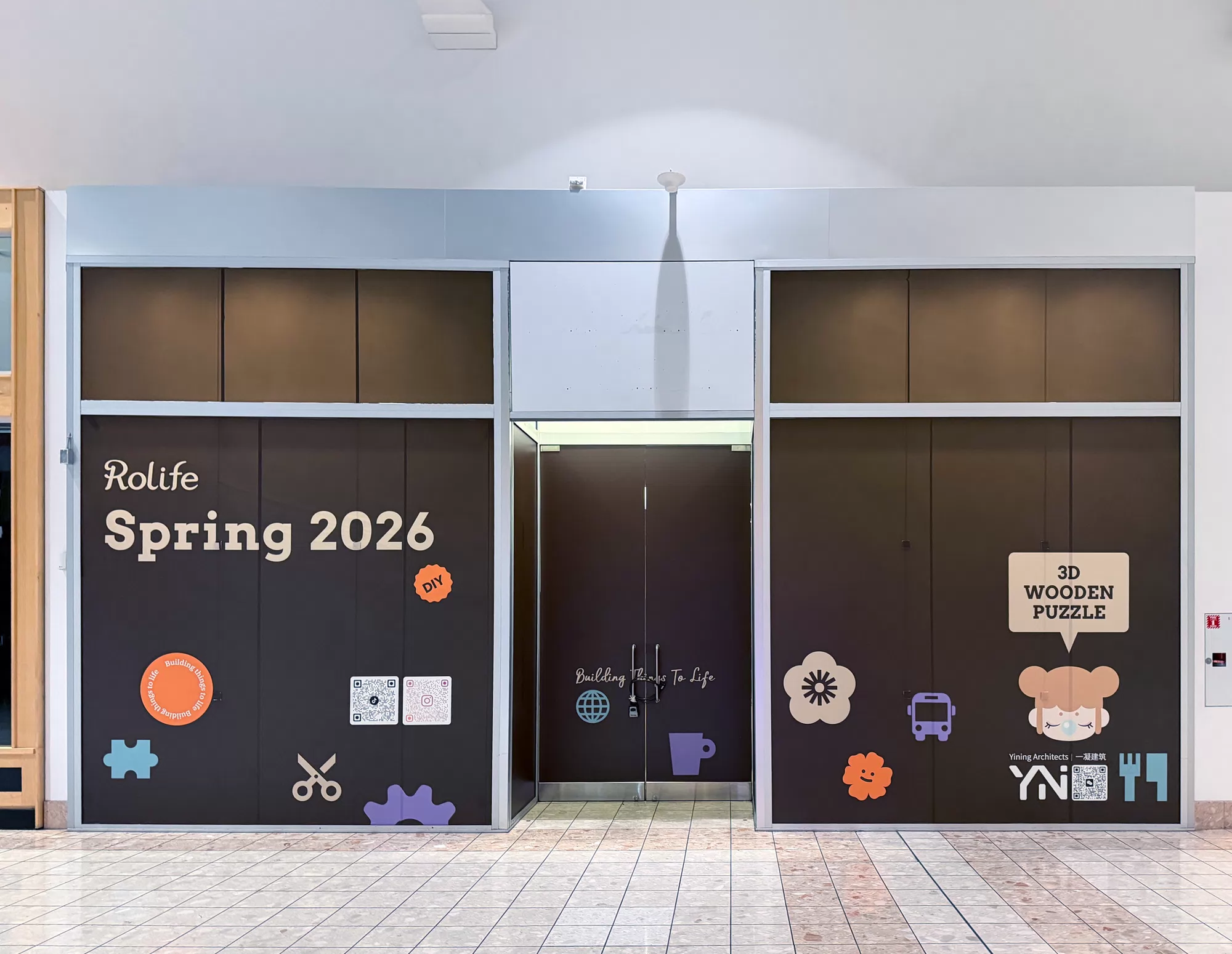 Rolife branded window graphics across a mall storefront